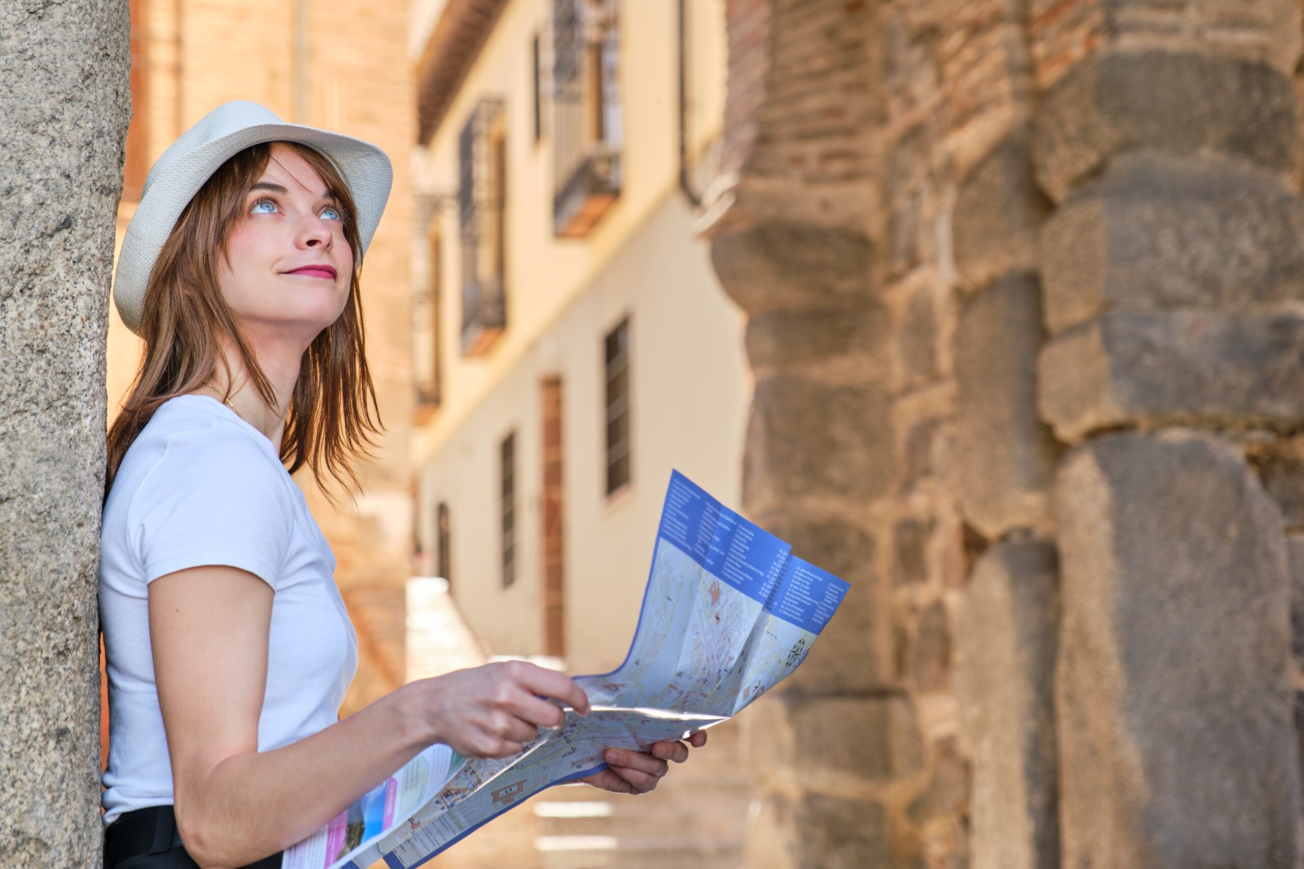 Young,Caucasian,Girl,In,A,White,Hat,With,A,Street